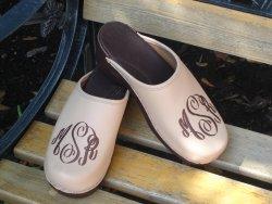 New natural leather clogs with brown interlocking monogram on brown flex heels New natural leather clogs 
